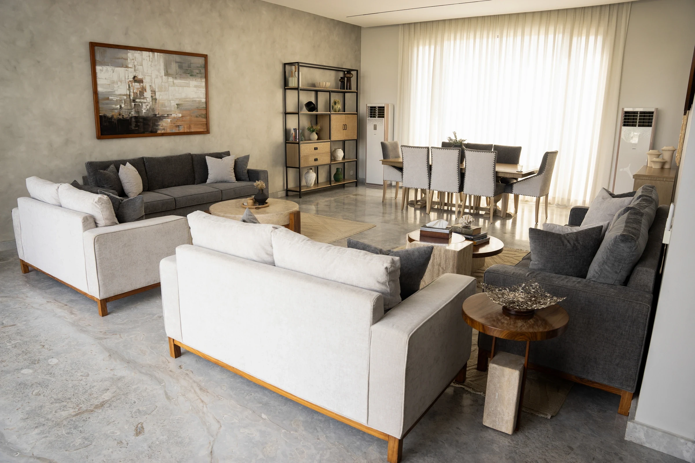 Wide composition showing the complete living and dining arrangement.