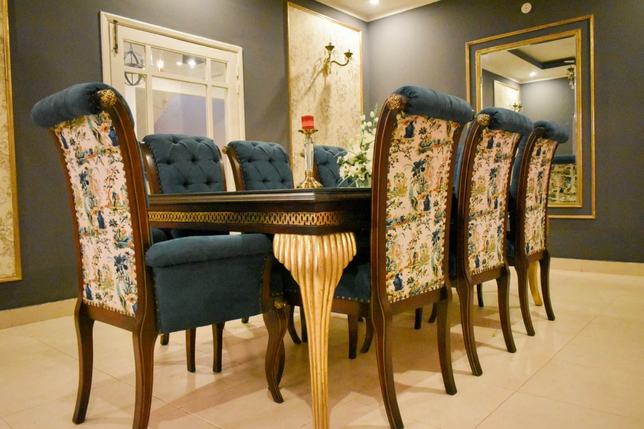 Low-angle composition focused on the dining furniture.