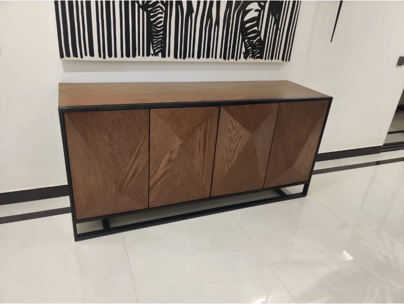 Product-focused cabinet with geometric door veneers.