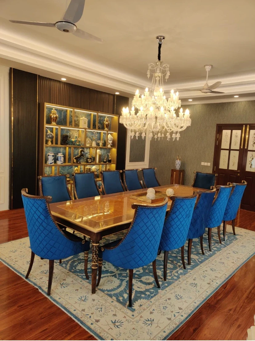 Complete dining room with blue upholstered chairs.