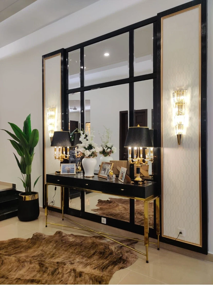 Architectural wall treatment and styled entry console.