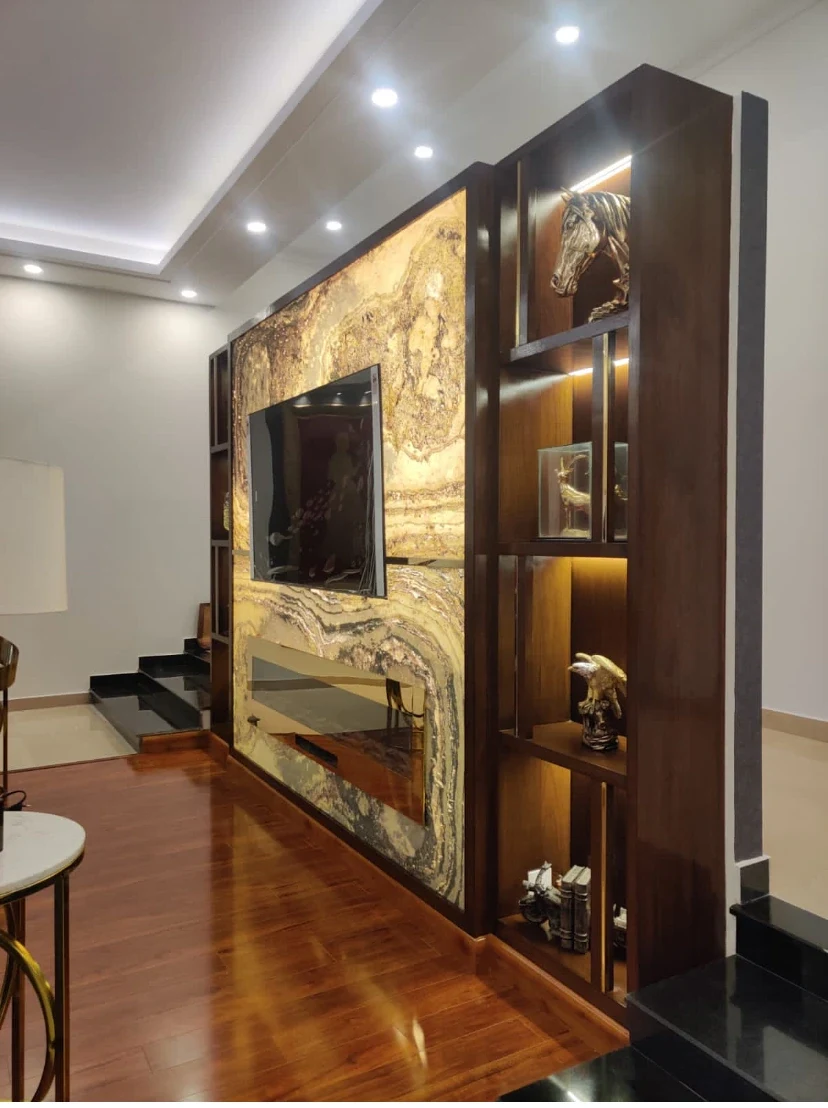 Built-in media wall and illuminated shelving.