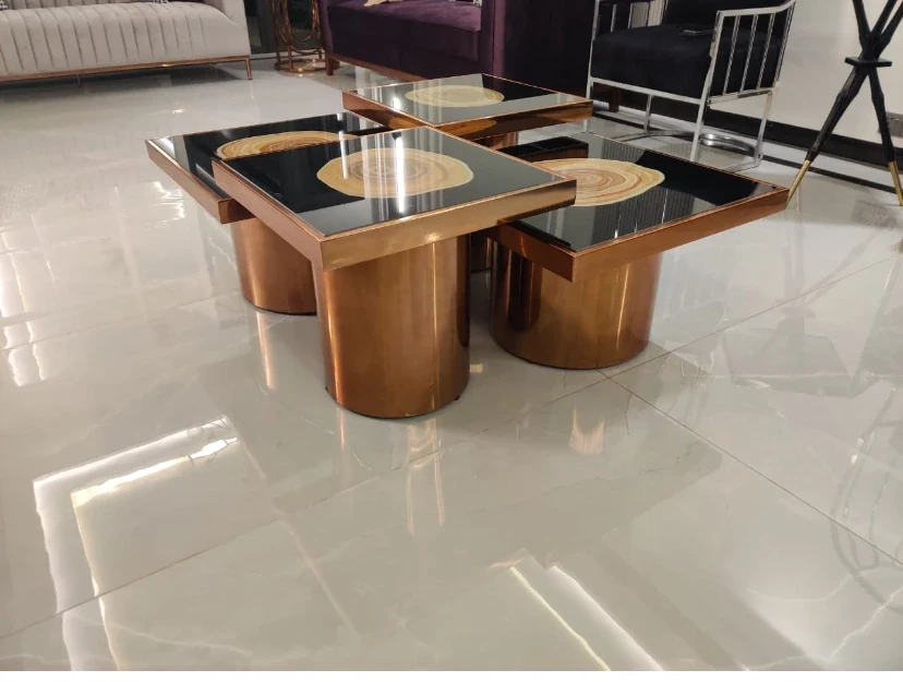 Close-up of black-and-gold coffee tables.