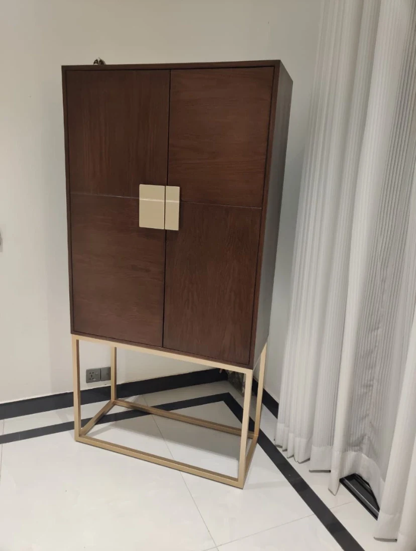 Tall cabinet on a metal base.