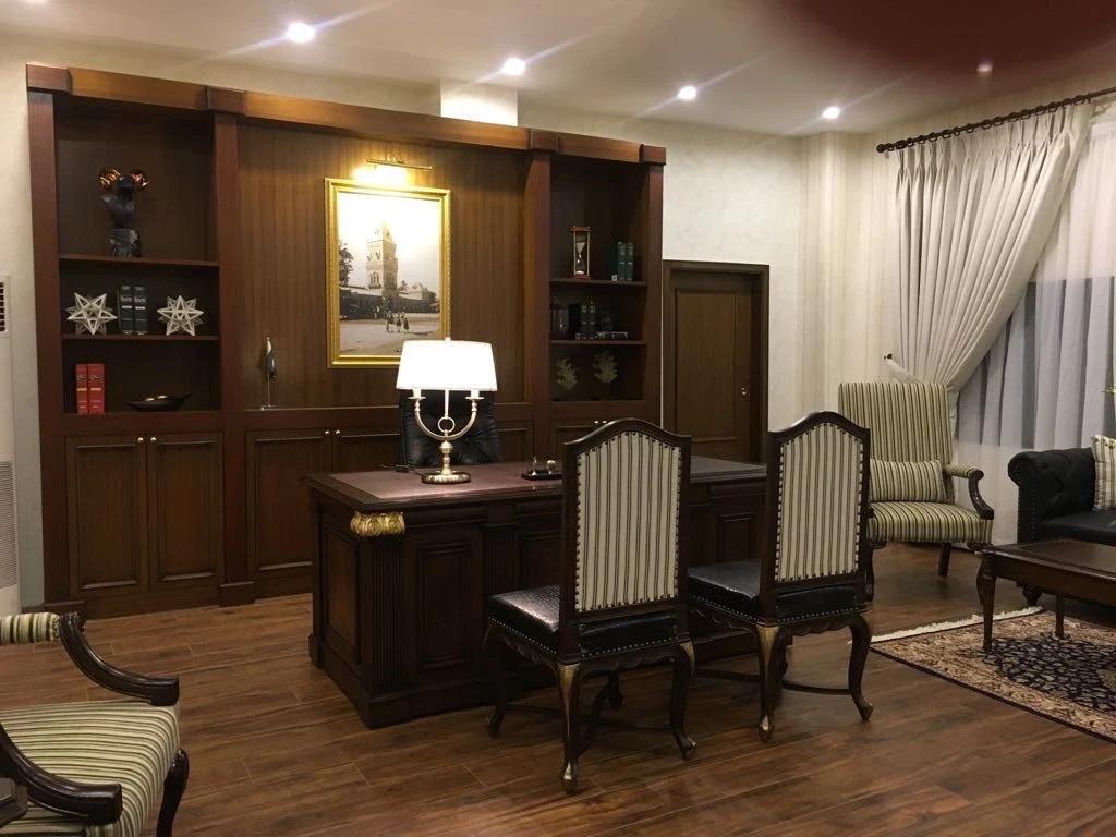 Office with timber joinery and updated furniture.